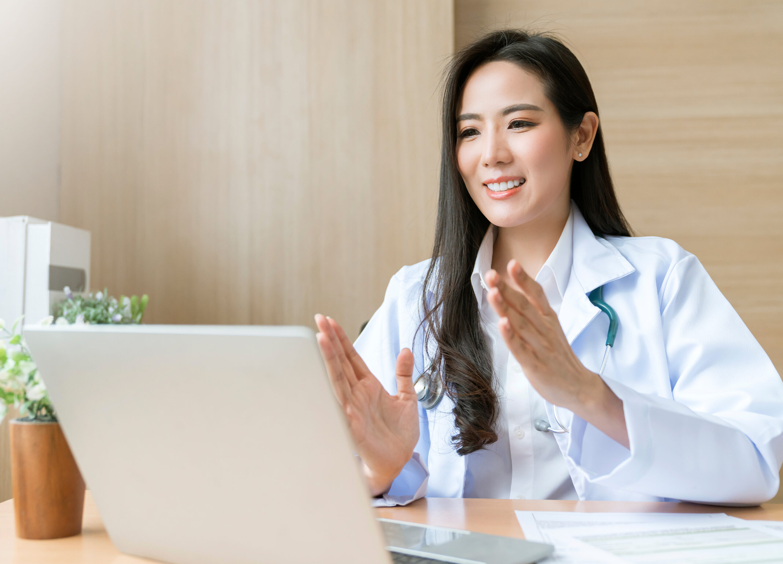 A smiling healthcare professional outdoors