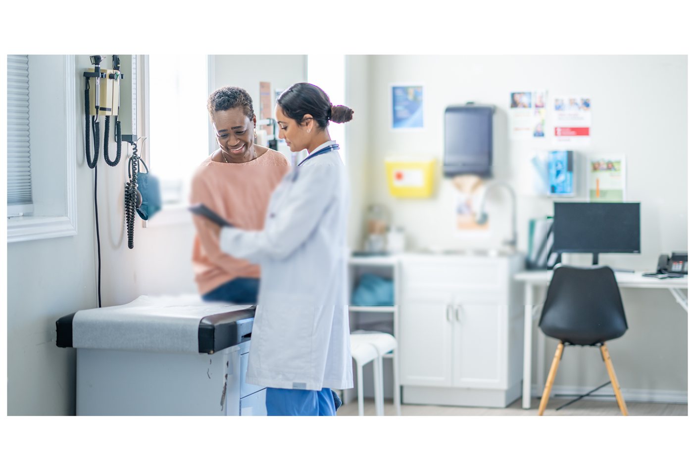 A clinician meeting with a patient