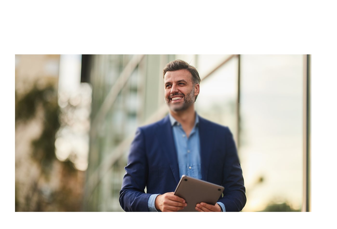 A smiling healthcare professional outdoors