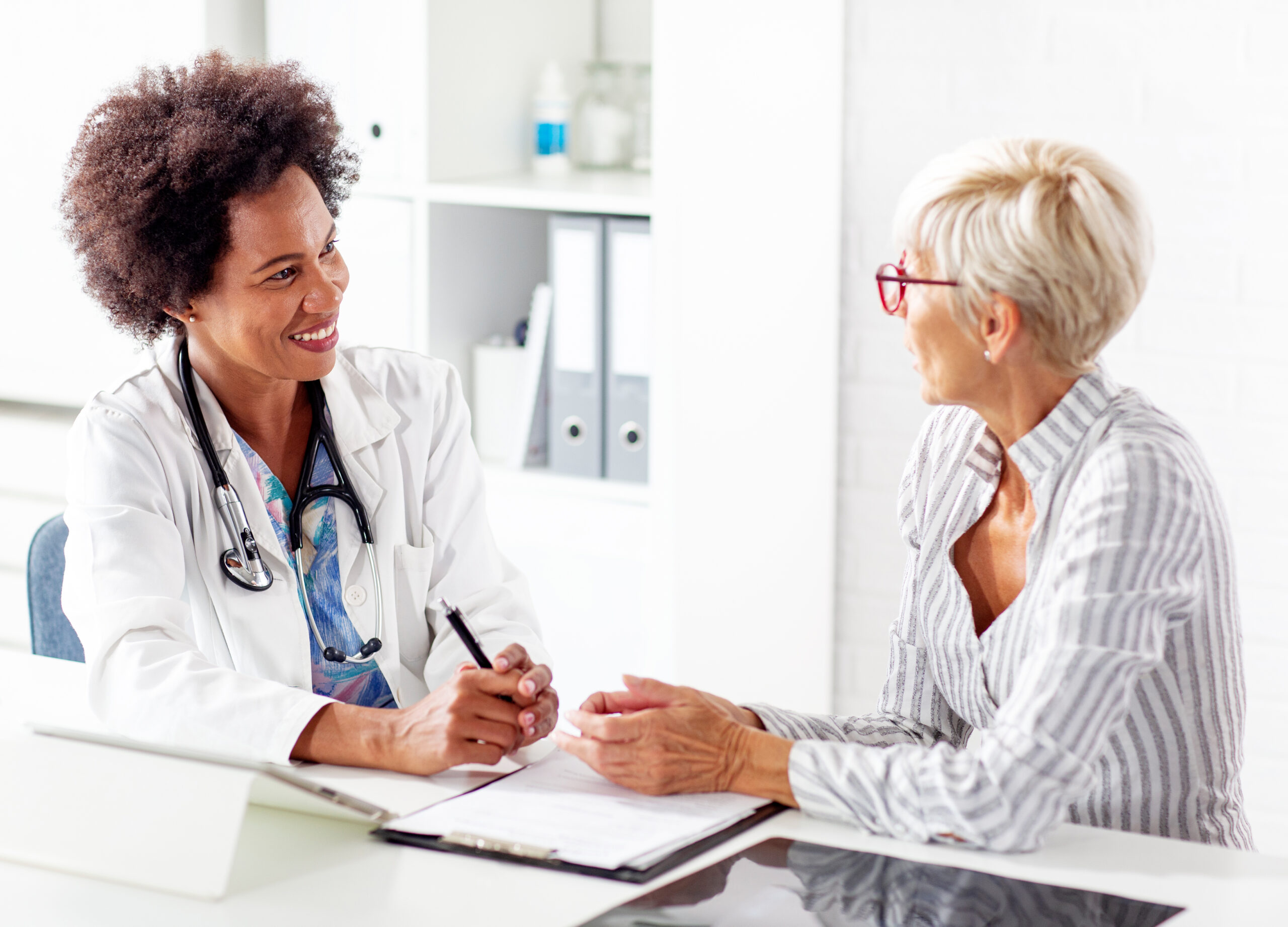 A clinician meeting with a patient
