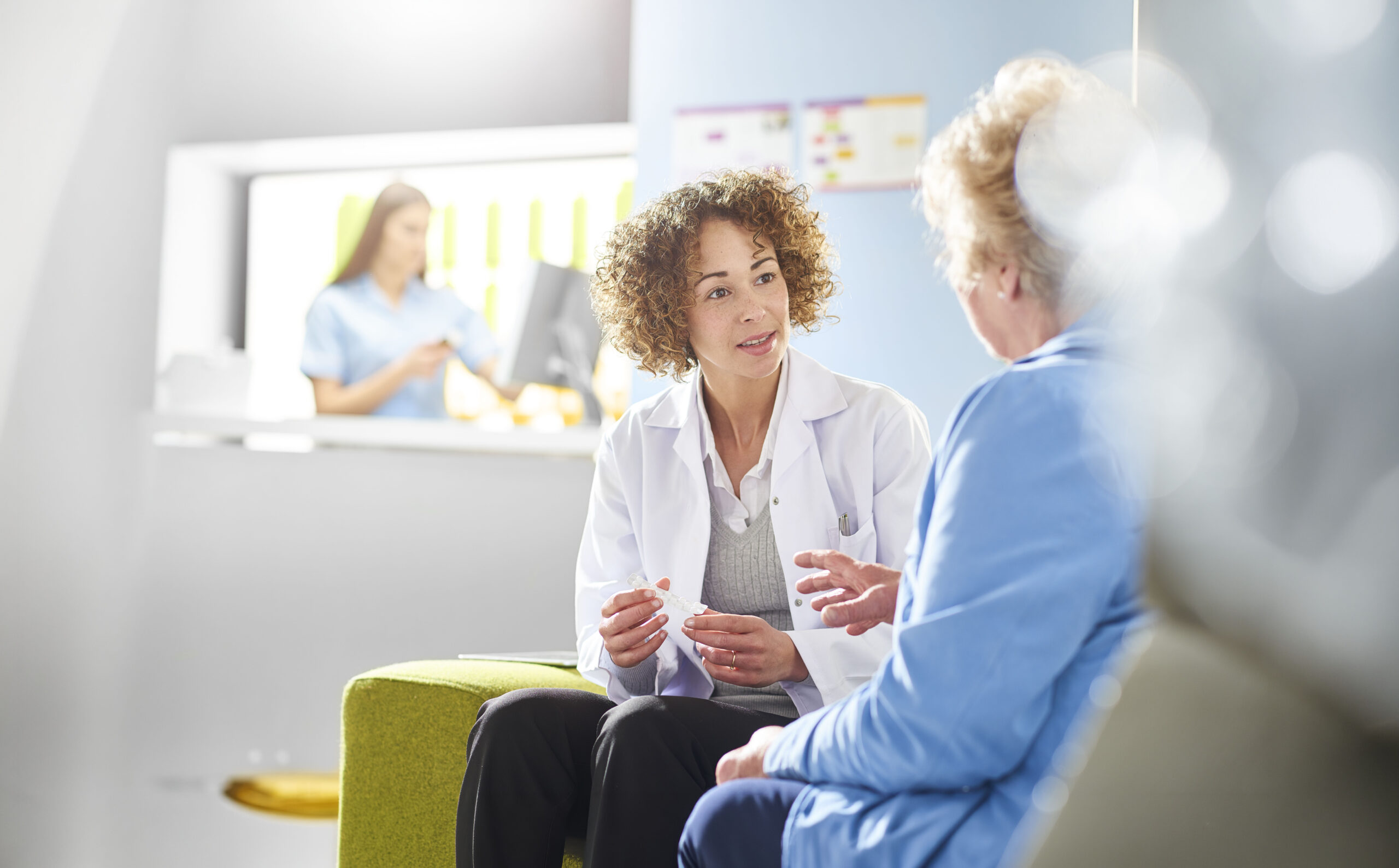 A clinician meeting with a patient